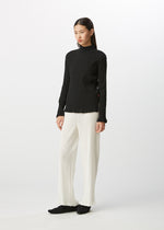 A model wears the HAAT  KYO CHIJIMI BASIC top