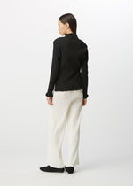 A model wears the HAAT  KYO CHIJIMI BASIC top