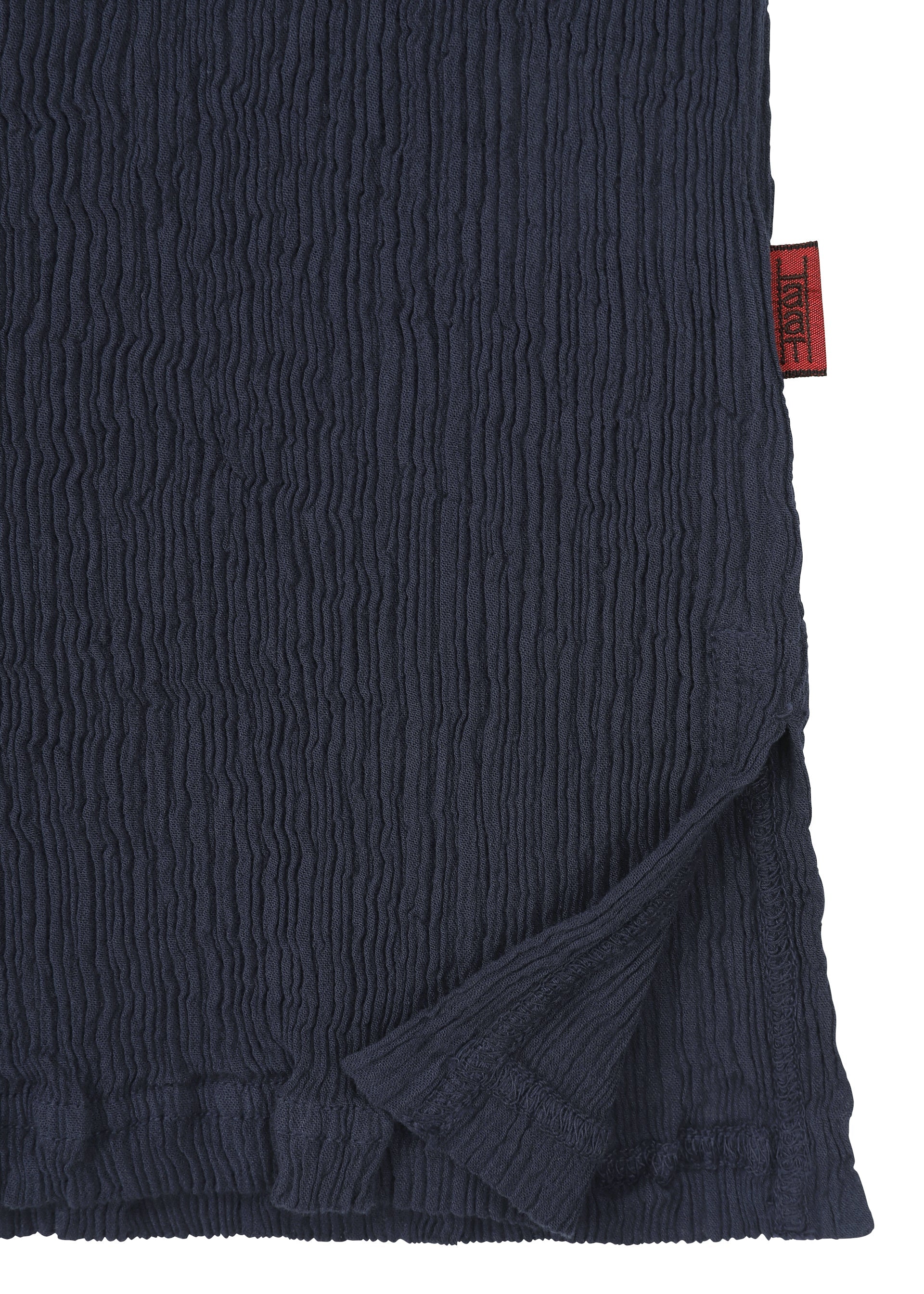 A detail shot of the HAAT  KYO CHIJIMI BASIC top