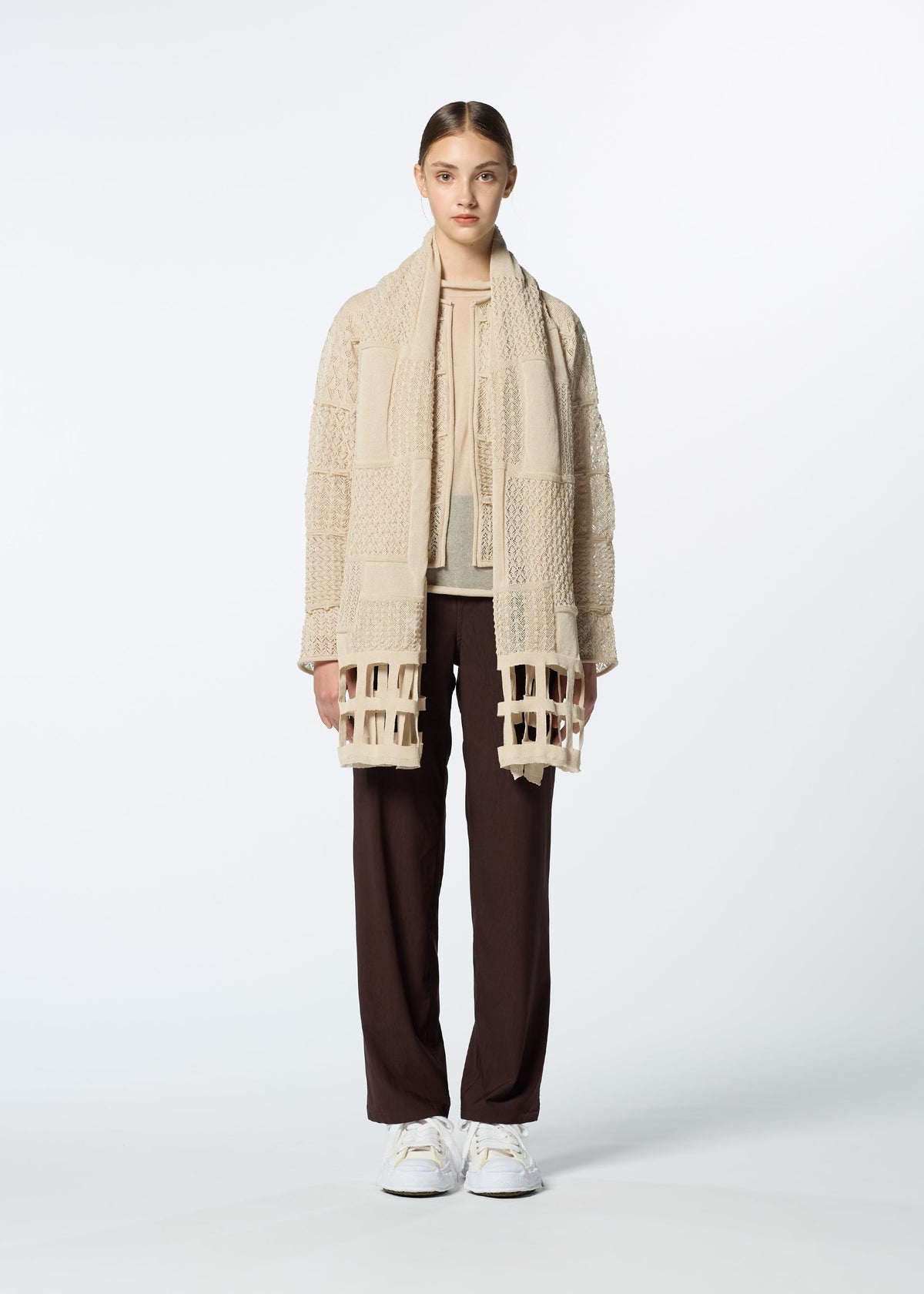 A model wears the HAAT SHEER MOSAIC stole.