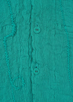 A detail shot of the HAAT KYO CHIJIMI EMB jacket.