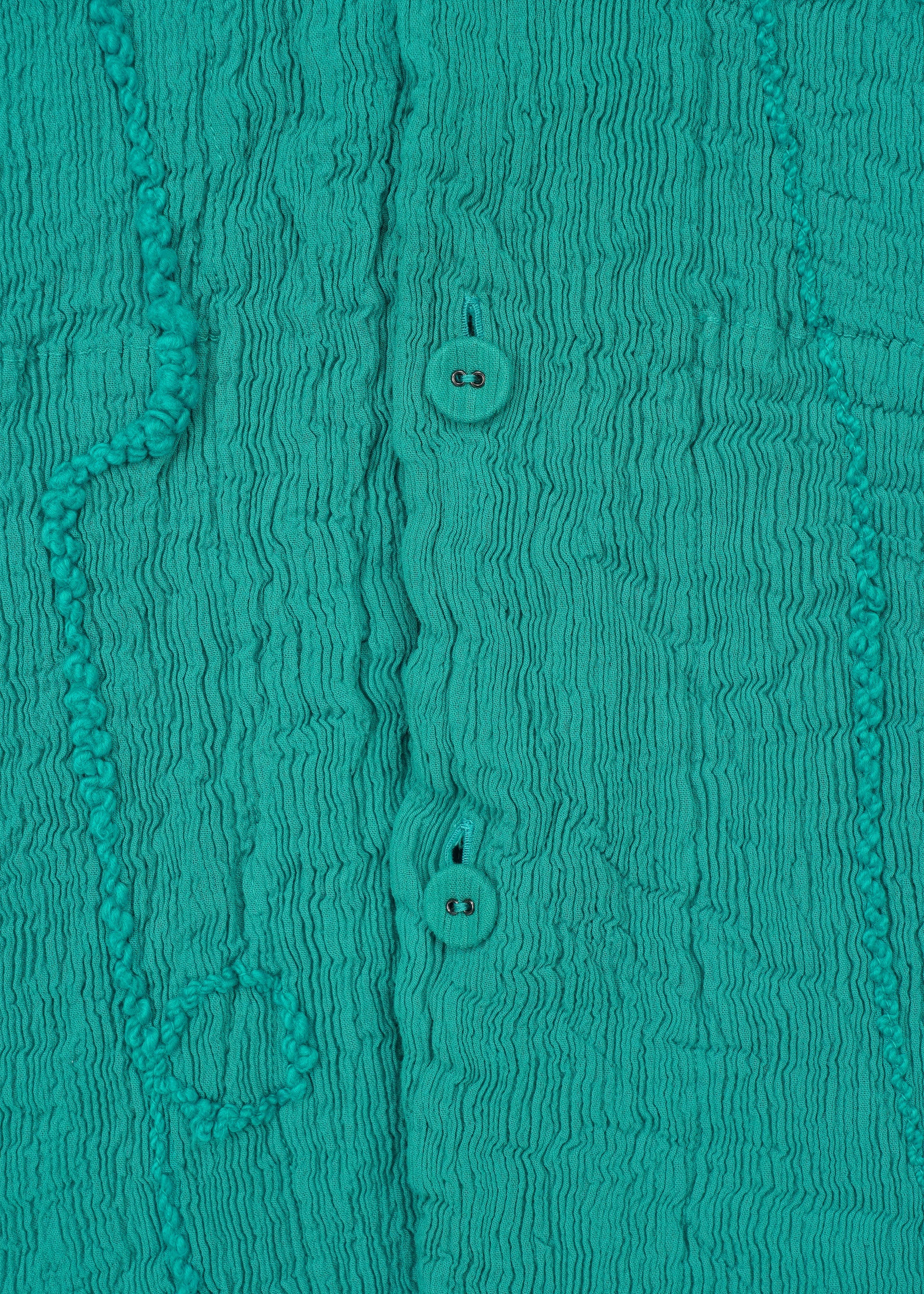 A detail shot of the HAAT KYO CHIJIMI EMB jacket.