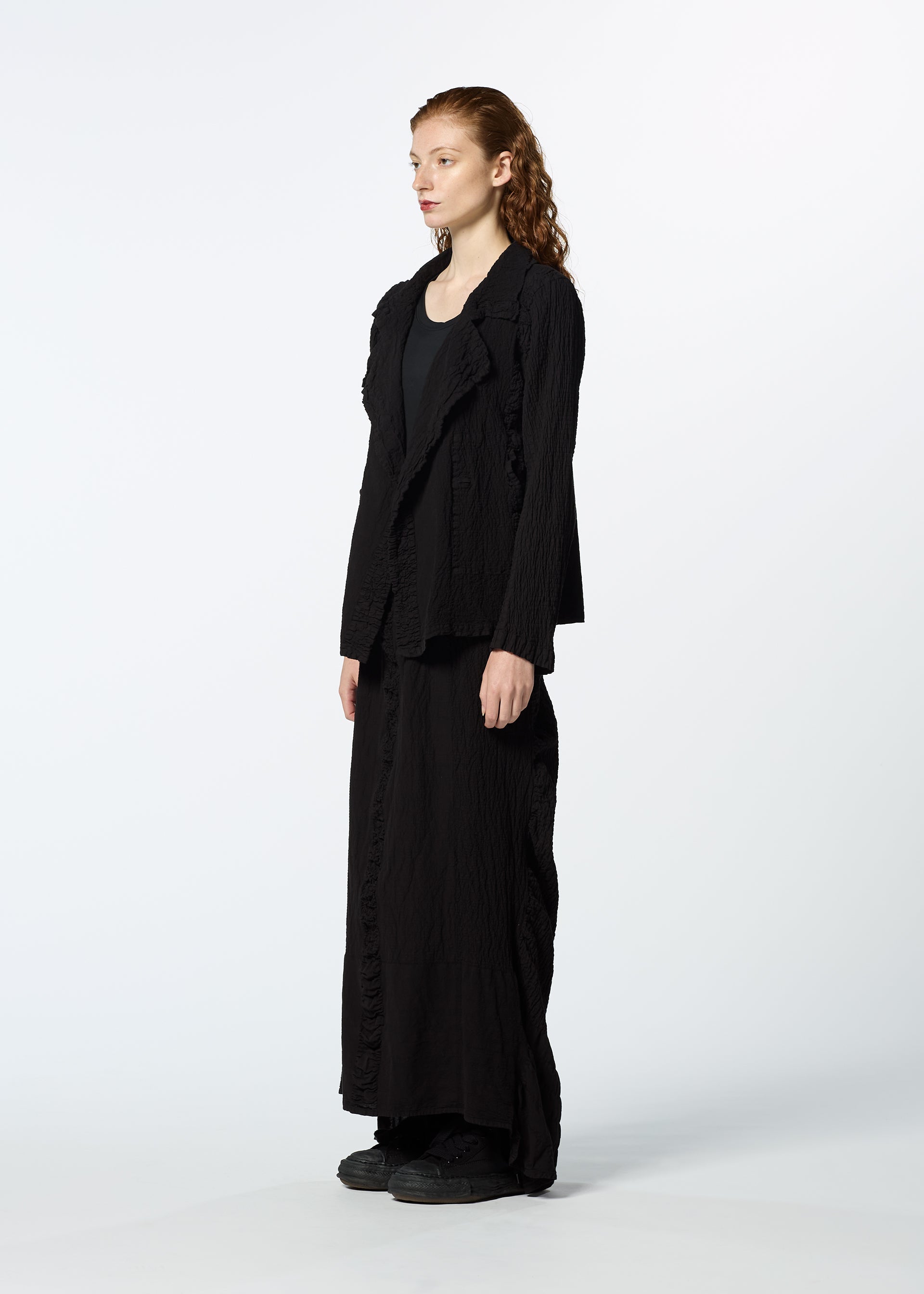 A model wears the HAAT TENMOKU COTTON jacket.