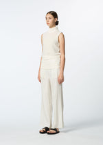 A model wears the HaaT SHIBARI BOTTOM shibari-bottom-trousers-white.