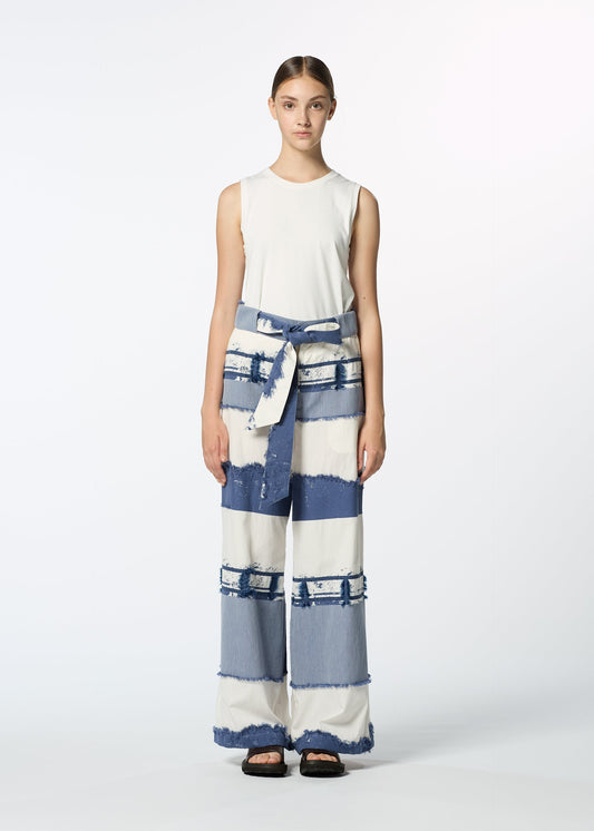 A model wears the HAAT KASANEGAKE trousers.