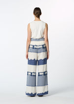 A model wears the HAAT KASANEGAKE trousers.