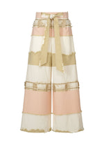 A product shot of the HAAT KASANEGAKE trousers in beige (41).