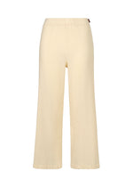 A product shot of the HAAT KYO CHIJIMI ITAJIME trousers in ivory (03).