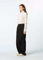 A model wears the HAAT TENMOKU BOTTOM trousers.
