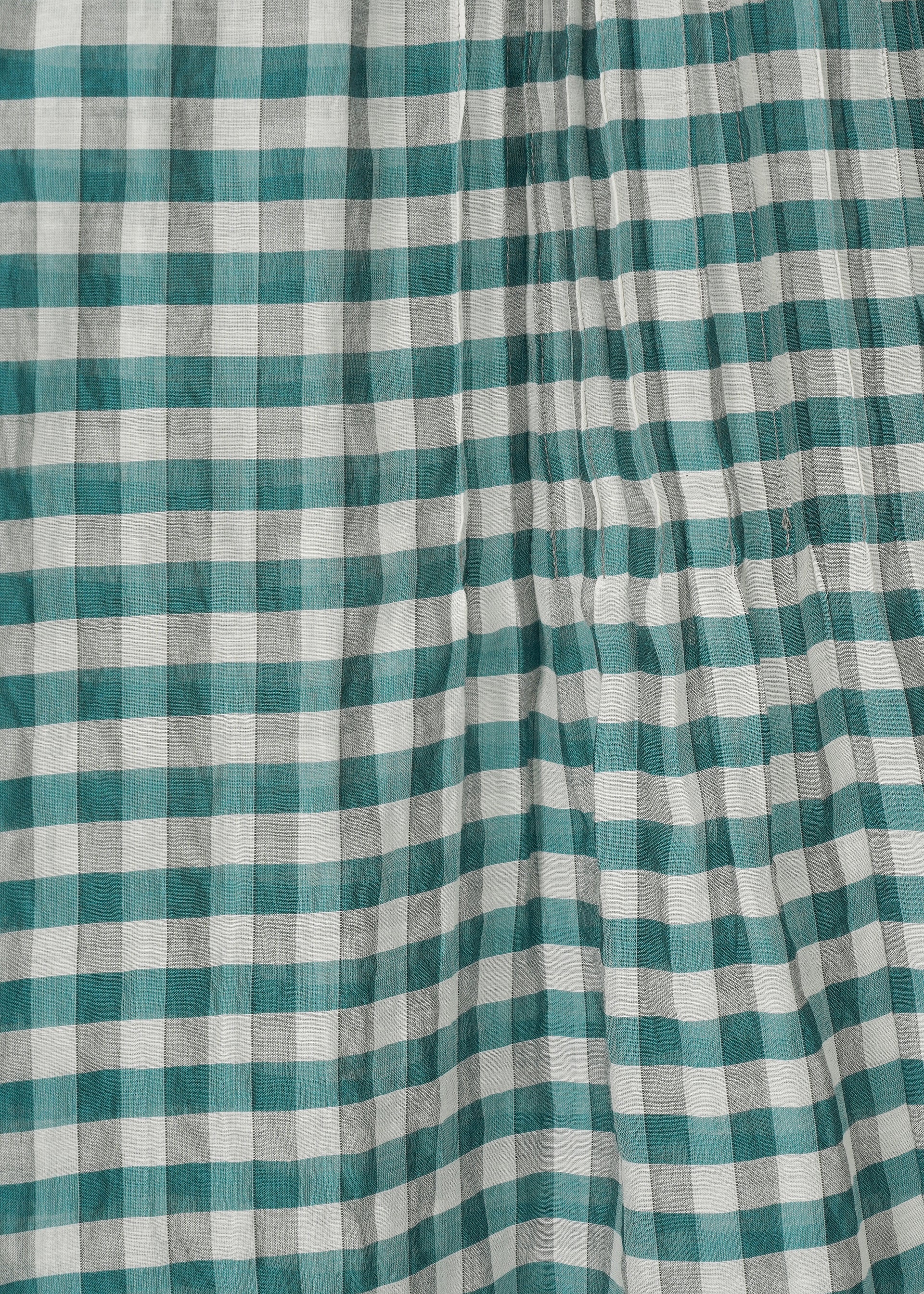 A detail shot of the HAAT 2 SIDE PINTUCKING skirt.