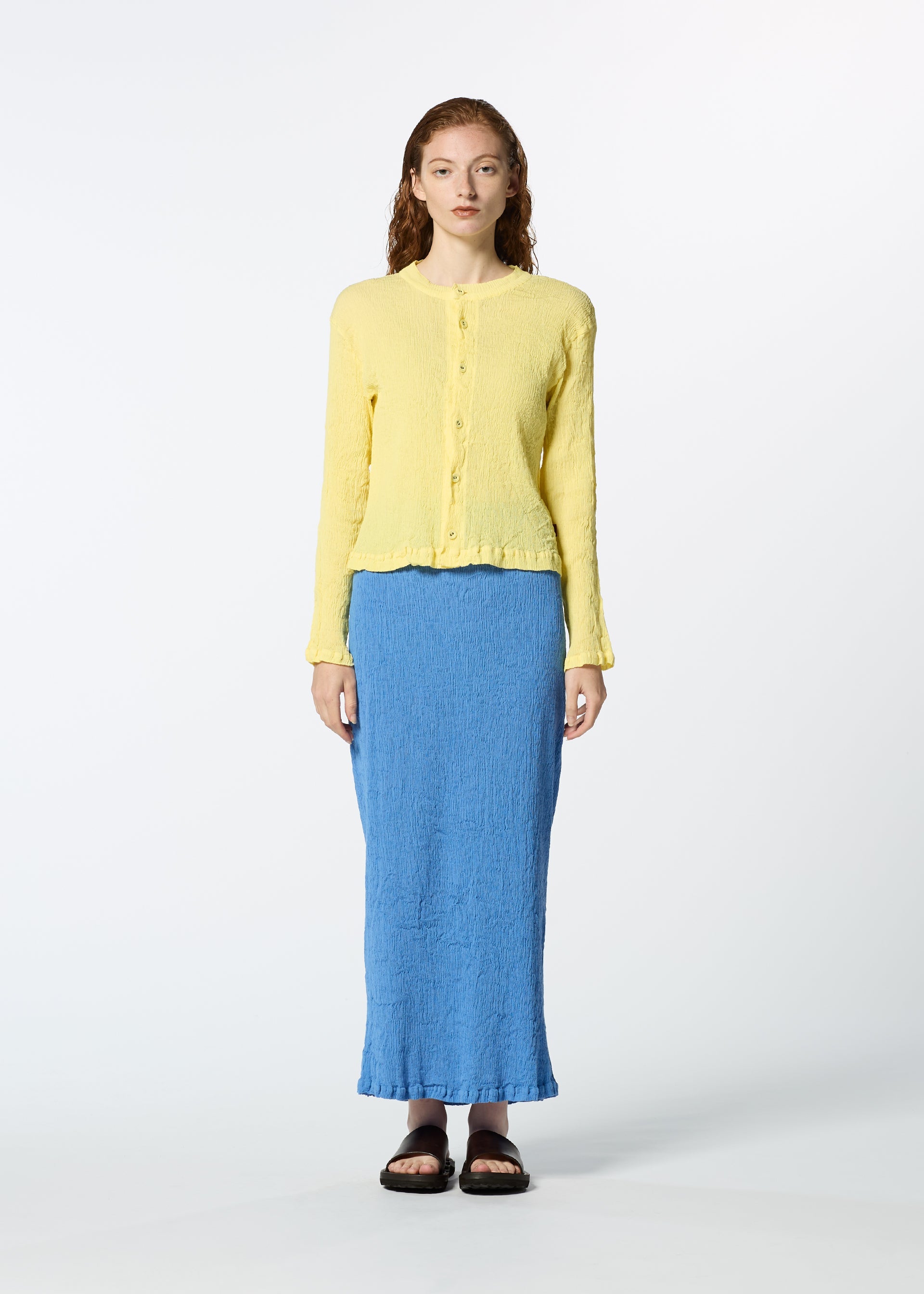 A model wears the HAAT KYO CHIJIMI MAY skirt.