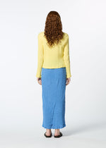 A model wears the HAAT KYO CHIJIMI MAY skirt.