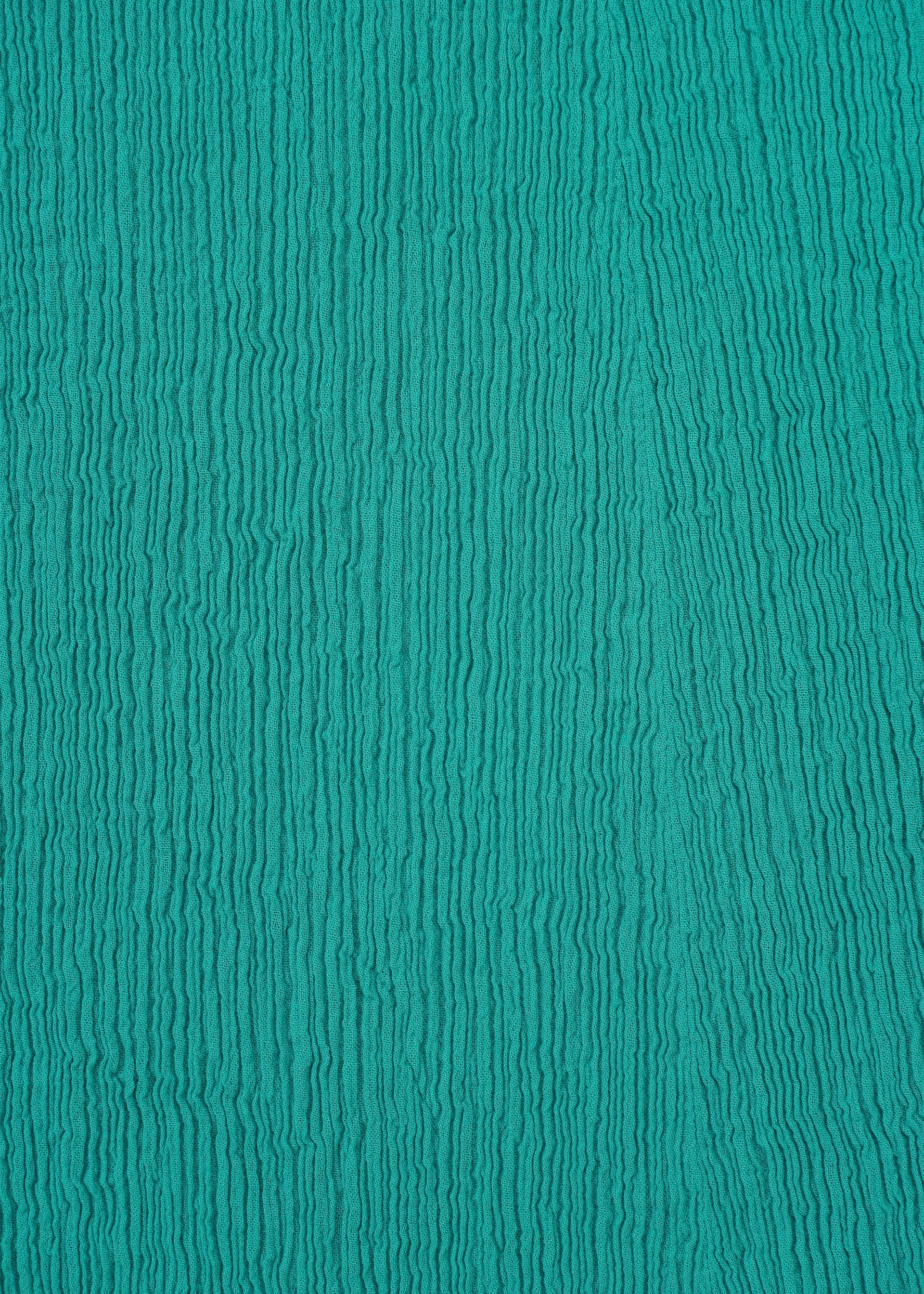 A detail shot of the HAAT KYO CHIJIMI EMB skirt.