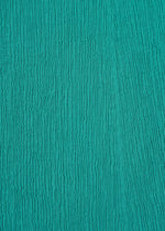 A detail shot of the HAAT KYO CHIJIMI EMB skirt.