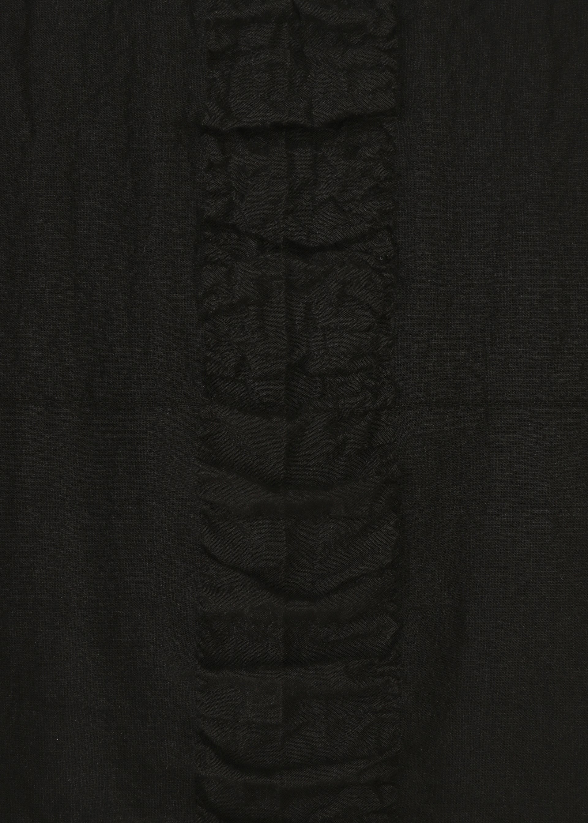 A detail shot of the HAAT TENMOKU COTTON skirt.