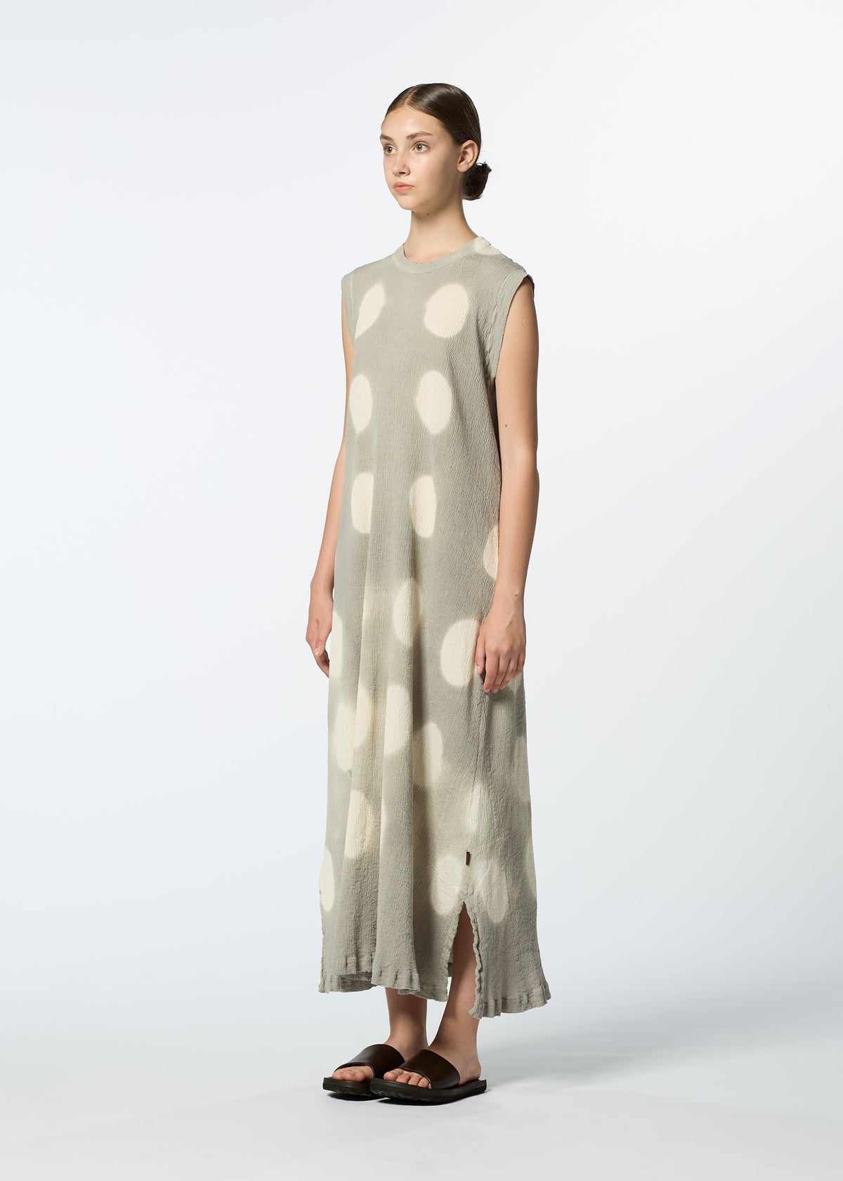 A model wears the HAAT KYO CHIJIMI ITAJIME dress.