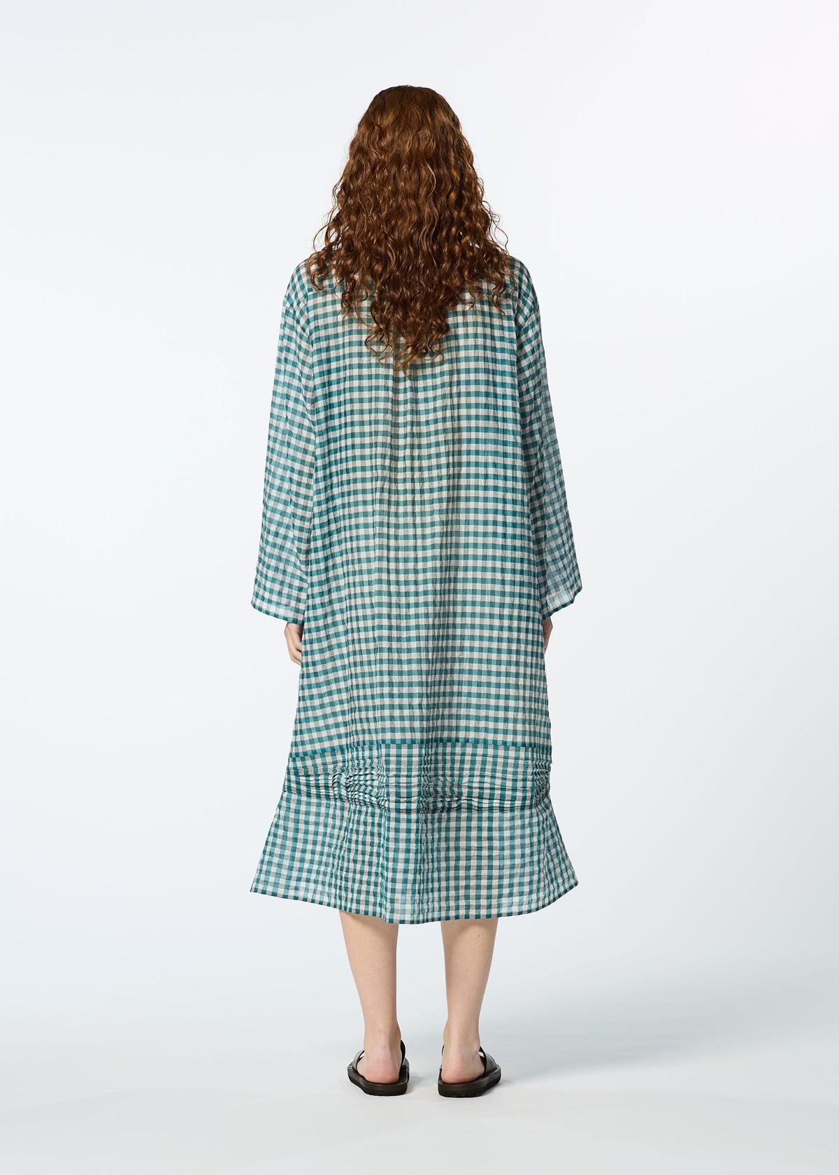 A model wears the HAAT 2 SIDE PINTUCKING dress.