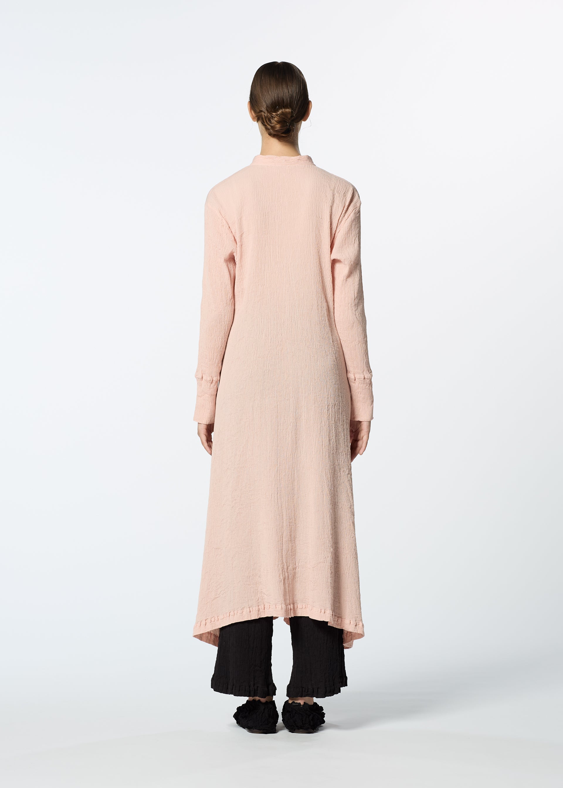 A model wears the HAAT KYO CHIJIMI FEBRUARY dress.