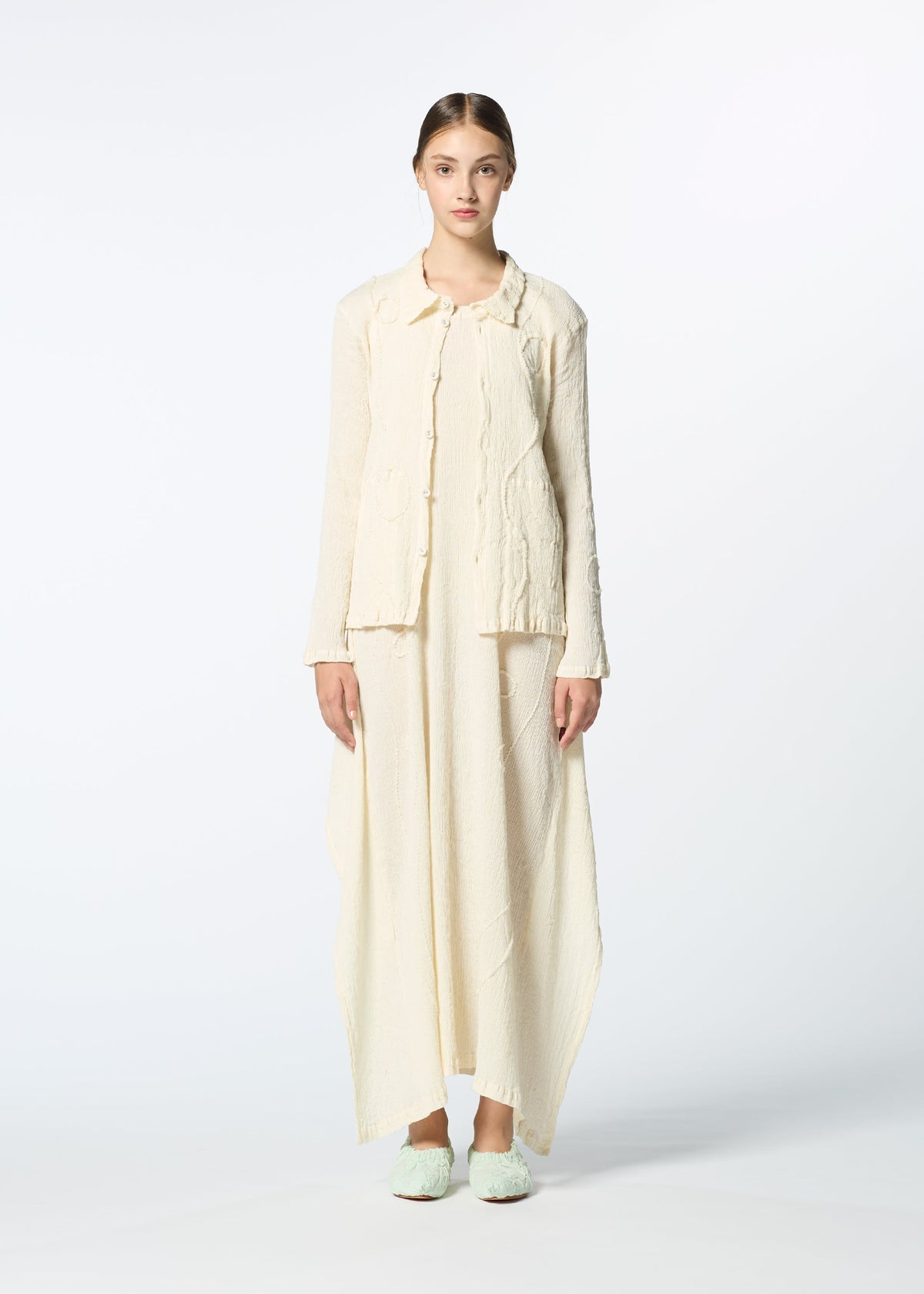 A model wears the HAAT KYO CHIJIMI EMB dress.