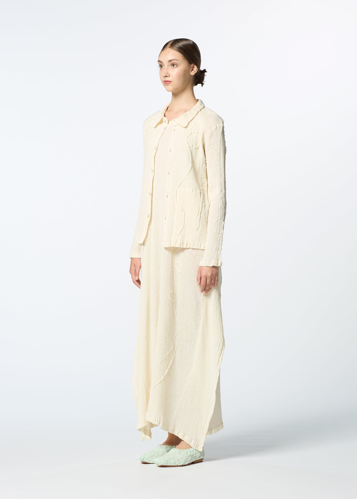 A model wears the HAAT KYO CHIJIMI EMB dress.