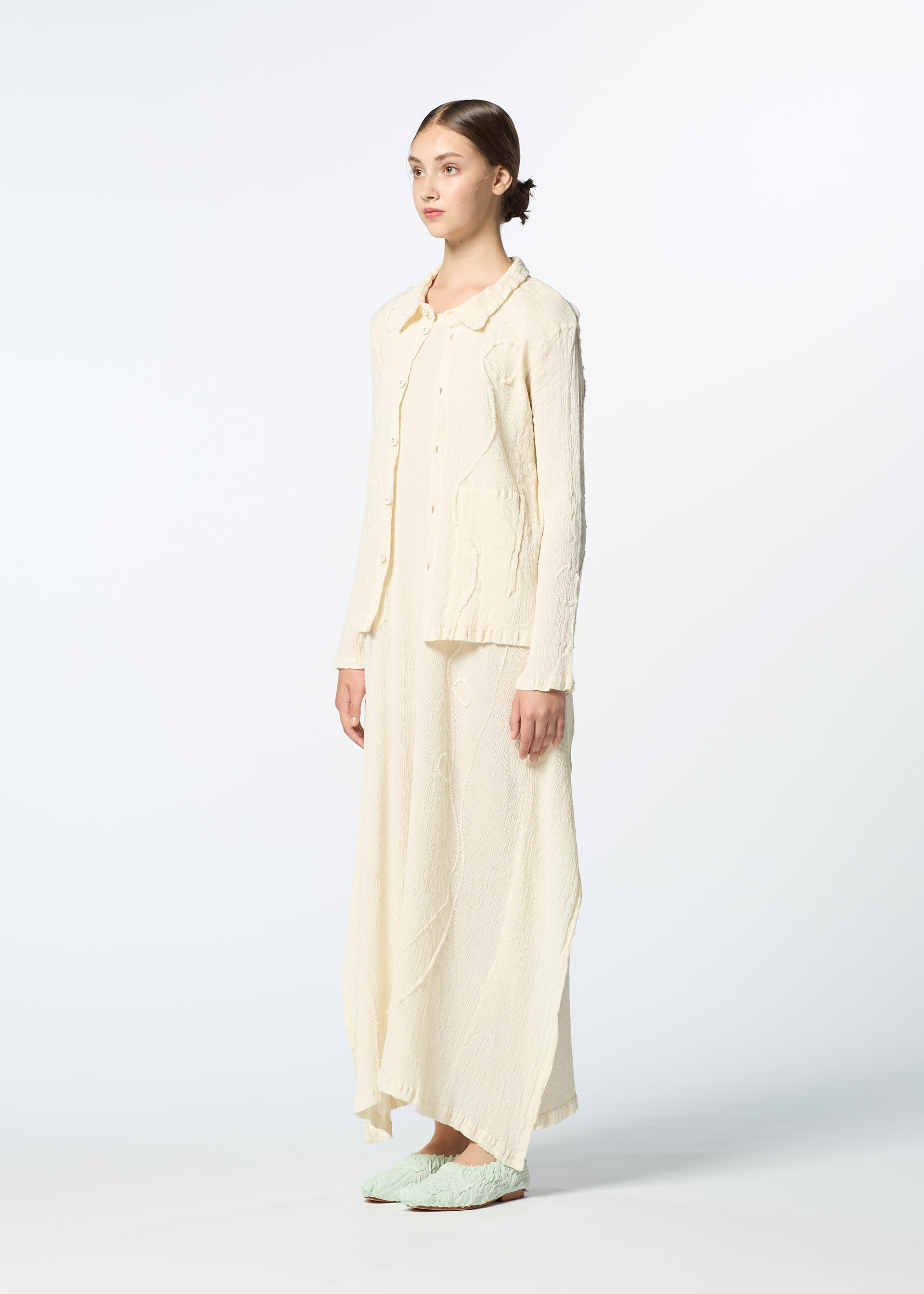 A model wears the HAAT KYO CHIJIMI EMB dress.