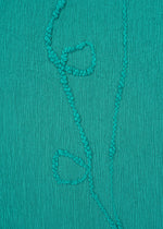 A detail shot of the HAAT KYO CHIJIMI EMB dress.