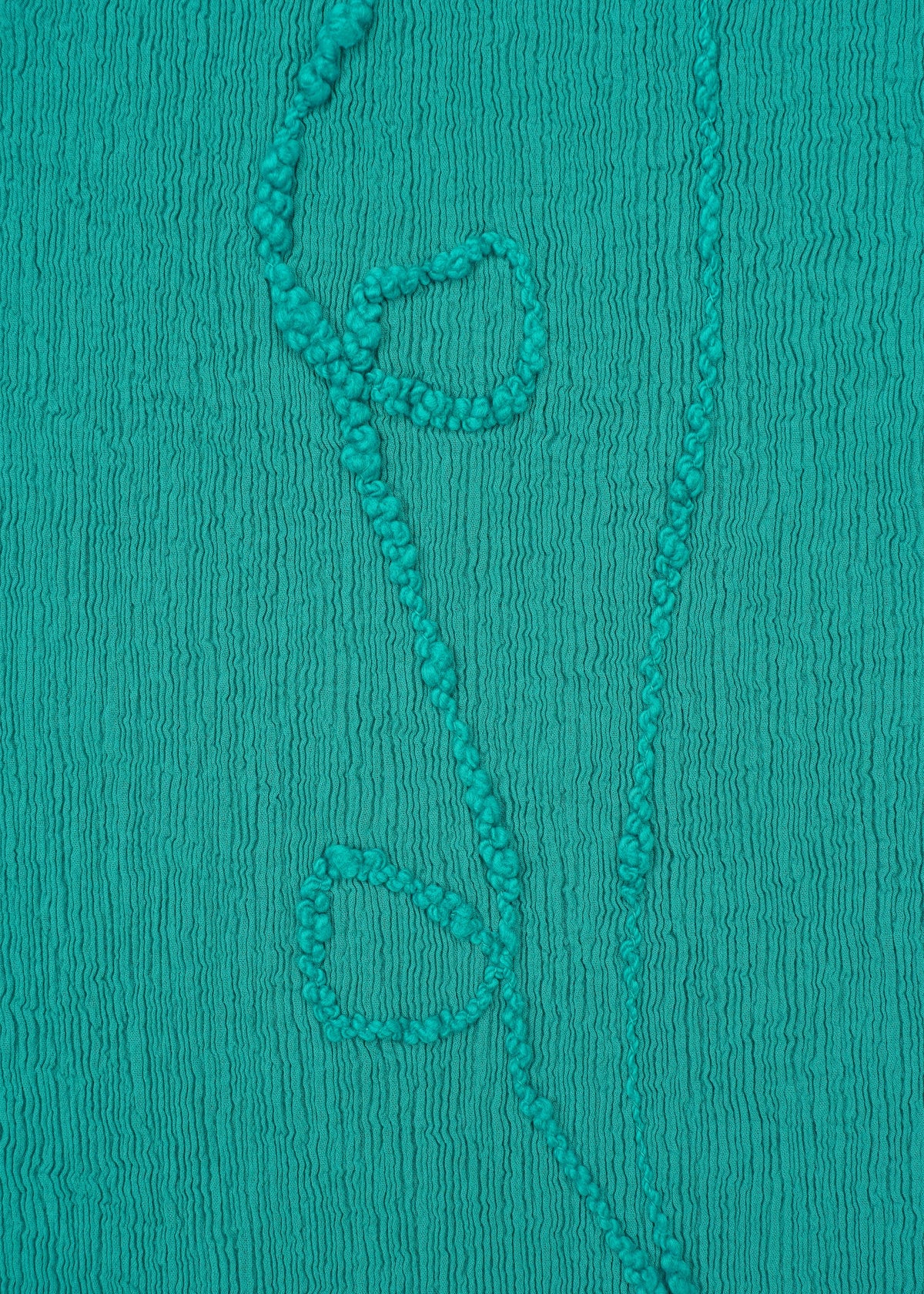 A detail shot of the HAAT KYO CHIJIMI EMB dress.