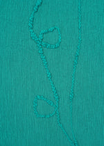 A detail shot of the HAAT KYO CHIJIMI EMB dress.