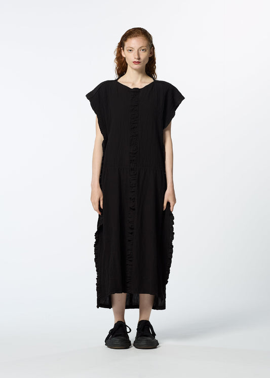 A model wears the HAAT TENMOKU COTTON dress.
