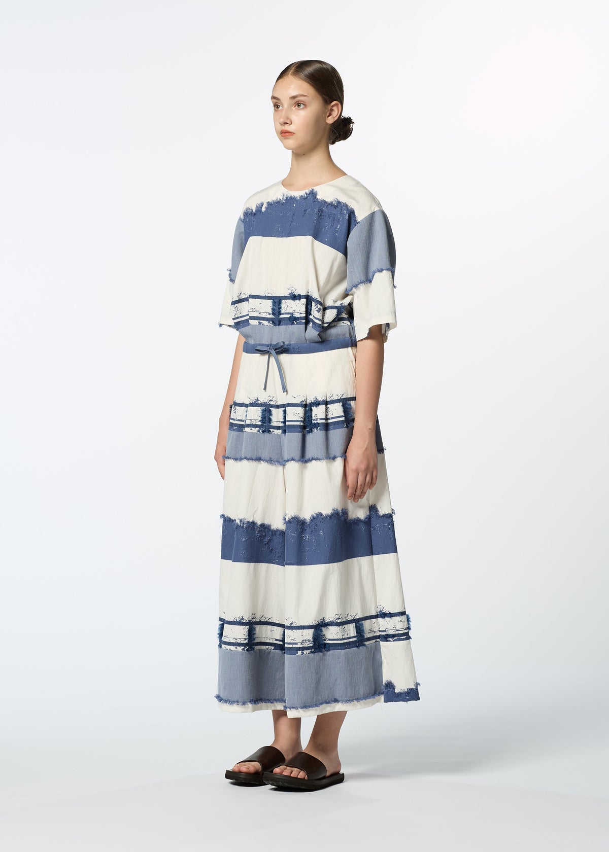 A model wears the HAAT KASANEGAKE jumpsuit.