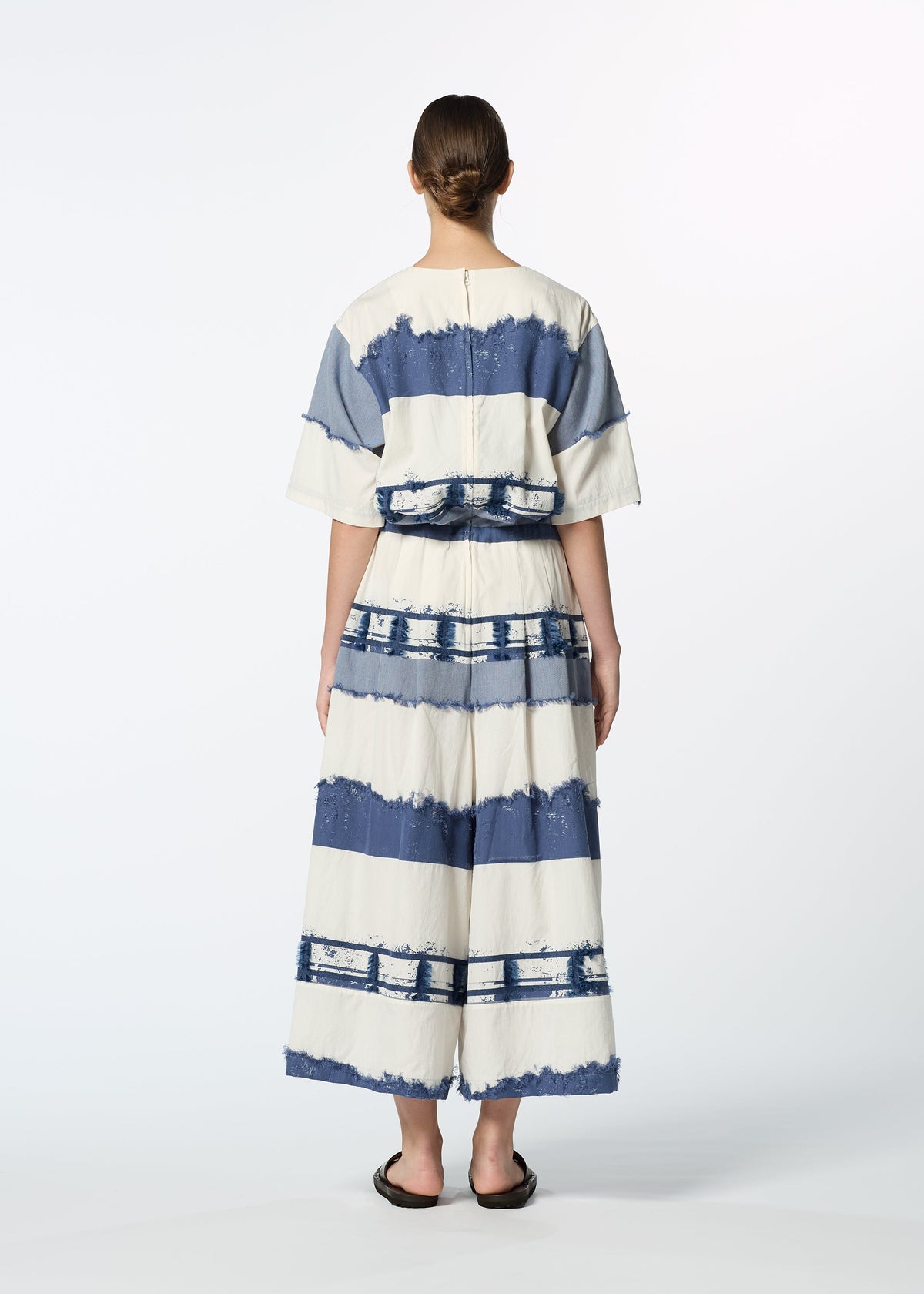 A model wears the HAAT KASANEGAKE jumpsuit.