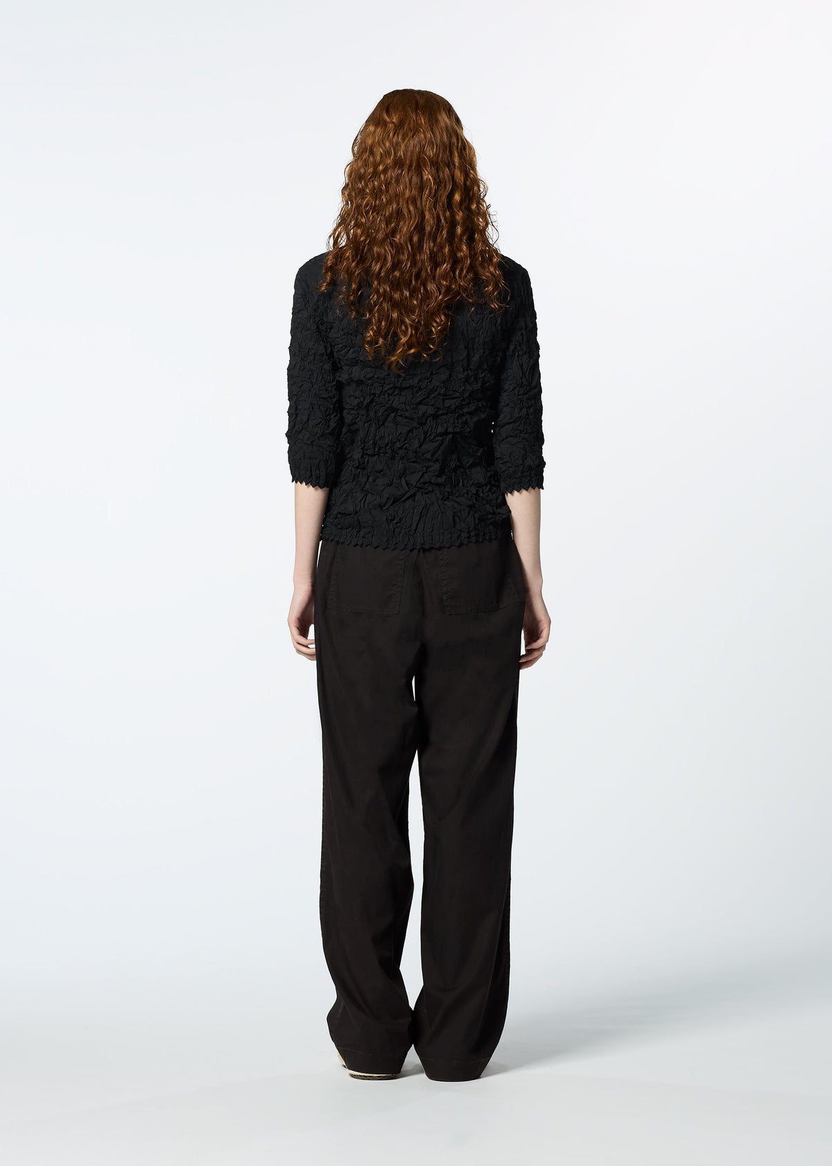 A model wears the HAAT KUMO SHIBORI SHIRT shirt.