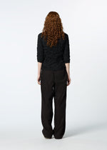 A model wears the HAAT KUMO SHIBORI SHIRT shirt.