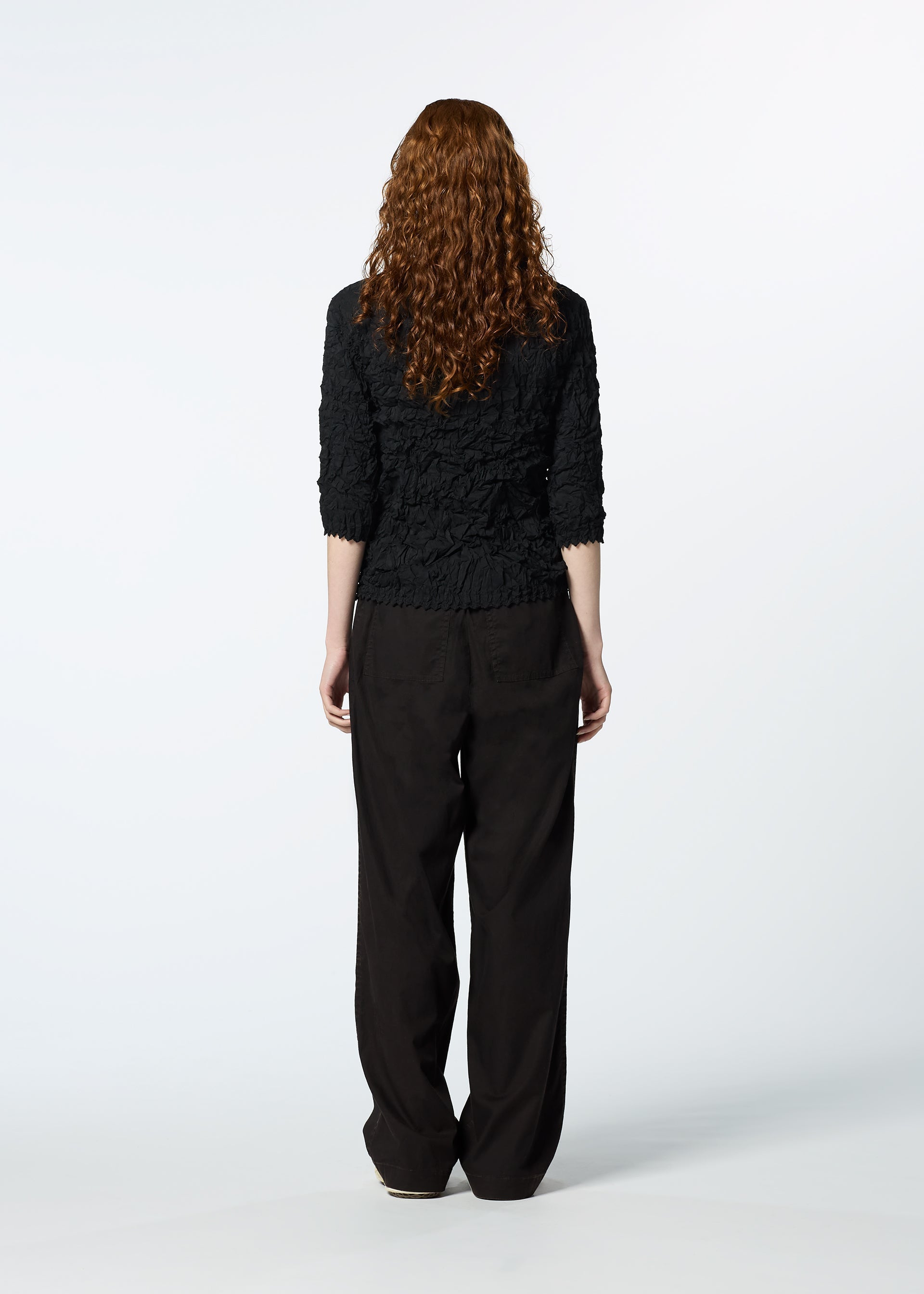 A model wears the HAAT KUMO SHIBORI SHIRT shirt.