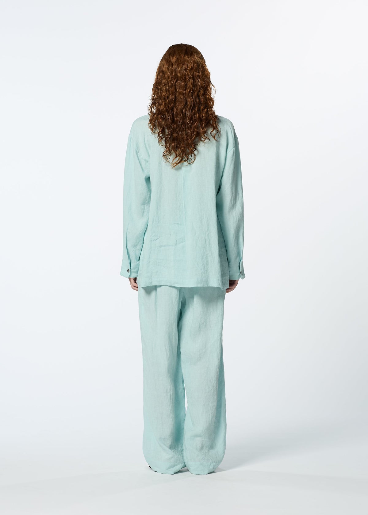 A model wears the HAAT JIKI shirt.
