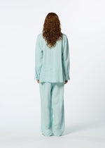 A model wears the HAAT JIKI shirt.