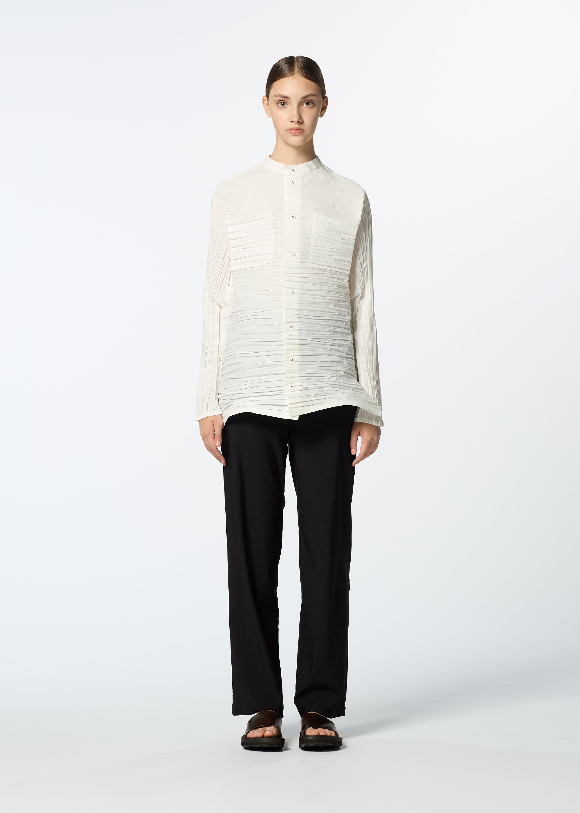 A model wears the HAAT SHIBARI SHIRT shirt.