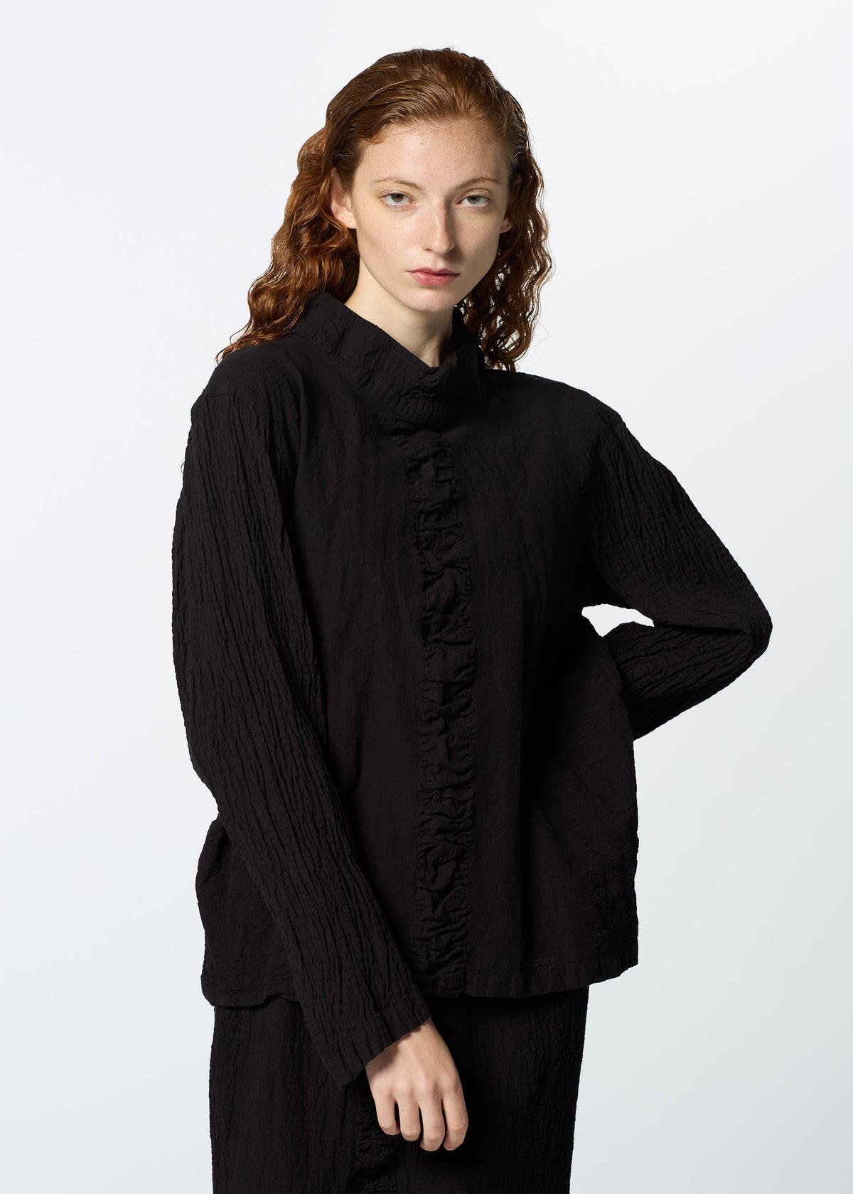 A model wears the HAAT TENMOKU COTTON shirt.
