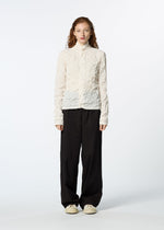 A model wears the HAAT KUMO SHIBORI SHIRT cardigan.