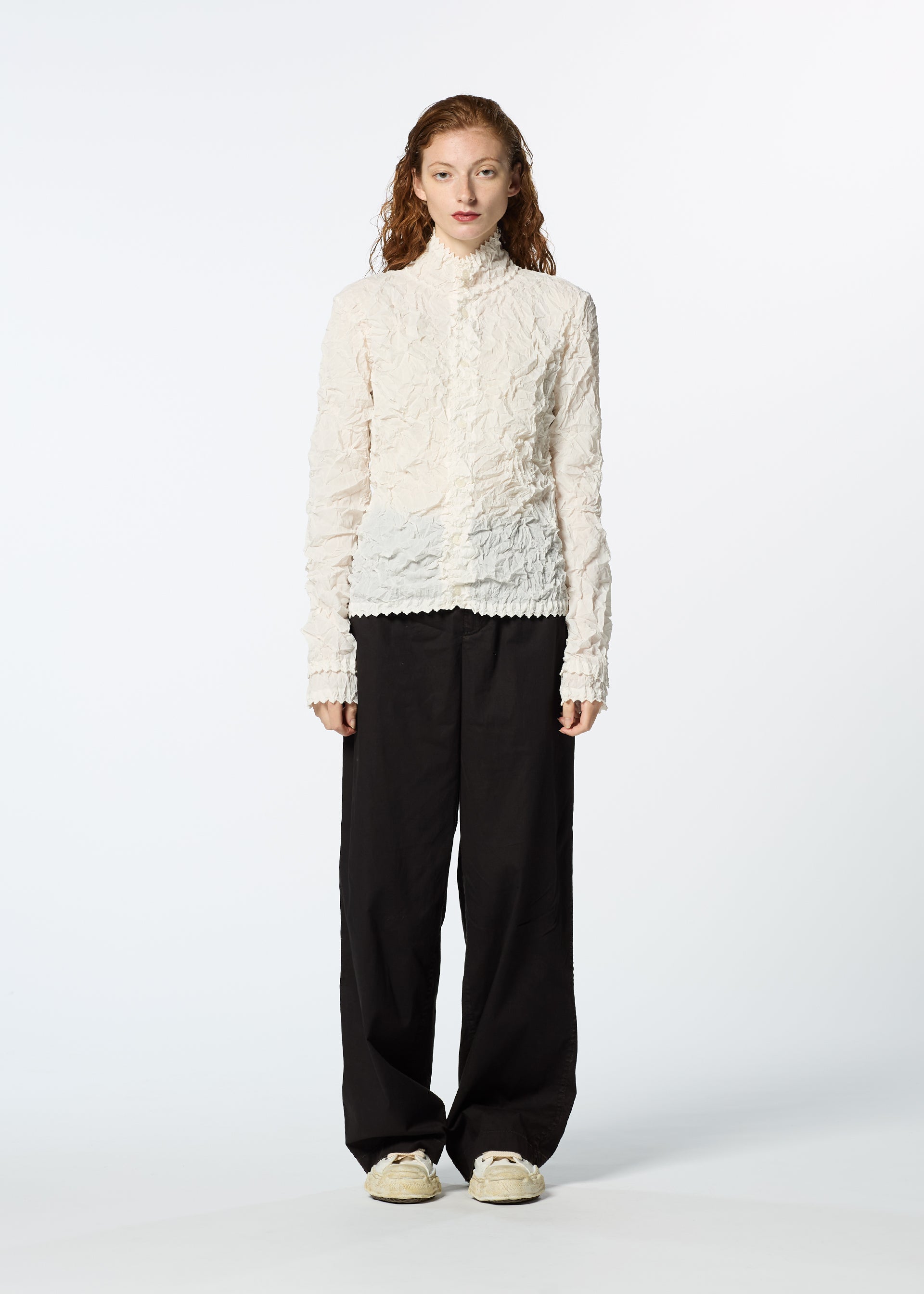 A model wears the HAAT KUMO SHIBORI SHIRT cardigan.