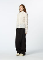 A model wears the HAAT KUMO SHIBORI SHIRT cardigan.