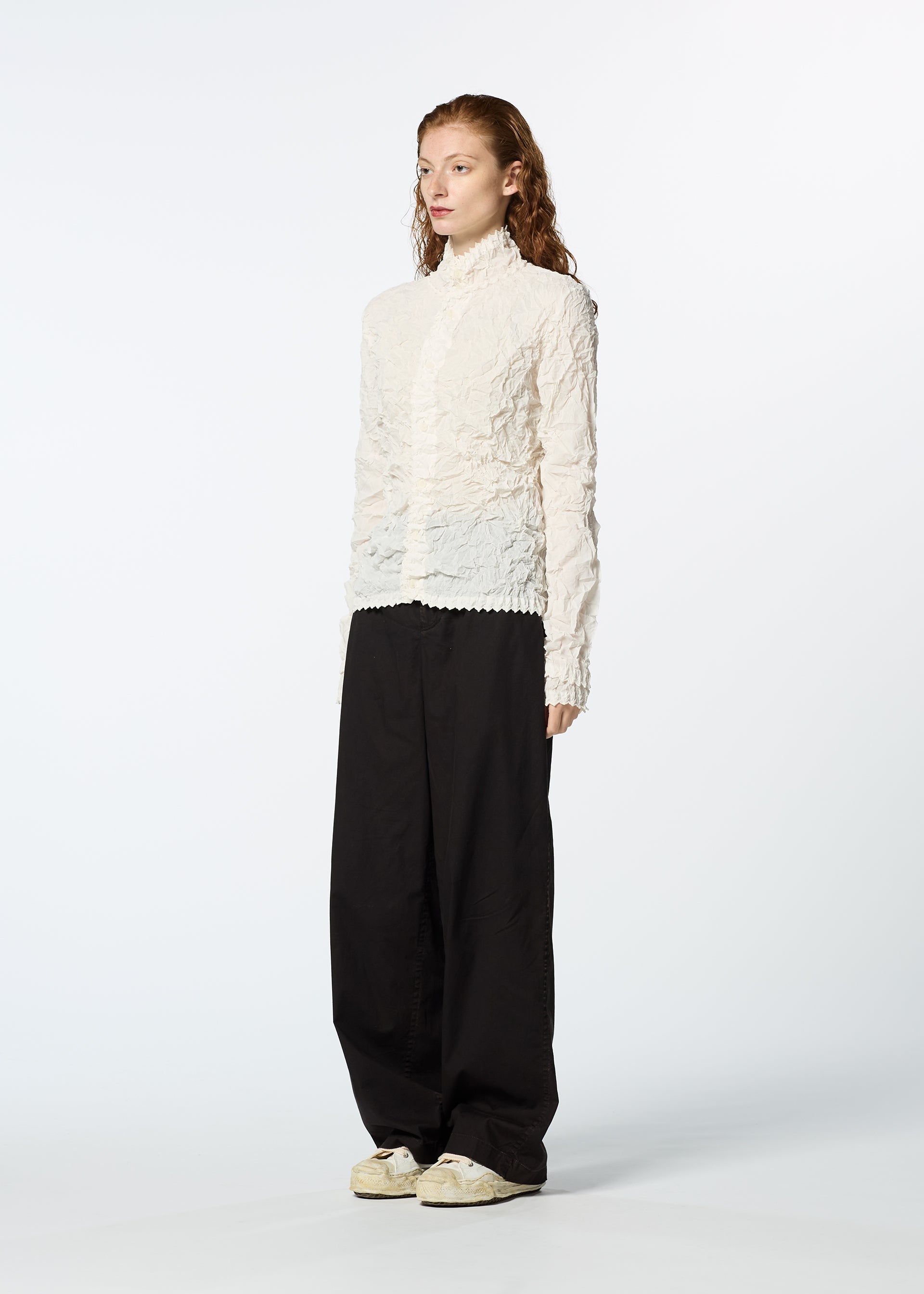 A model wears the HAAT KUMO SHIBORI SHIRT cardigan.