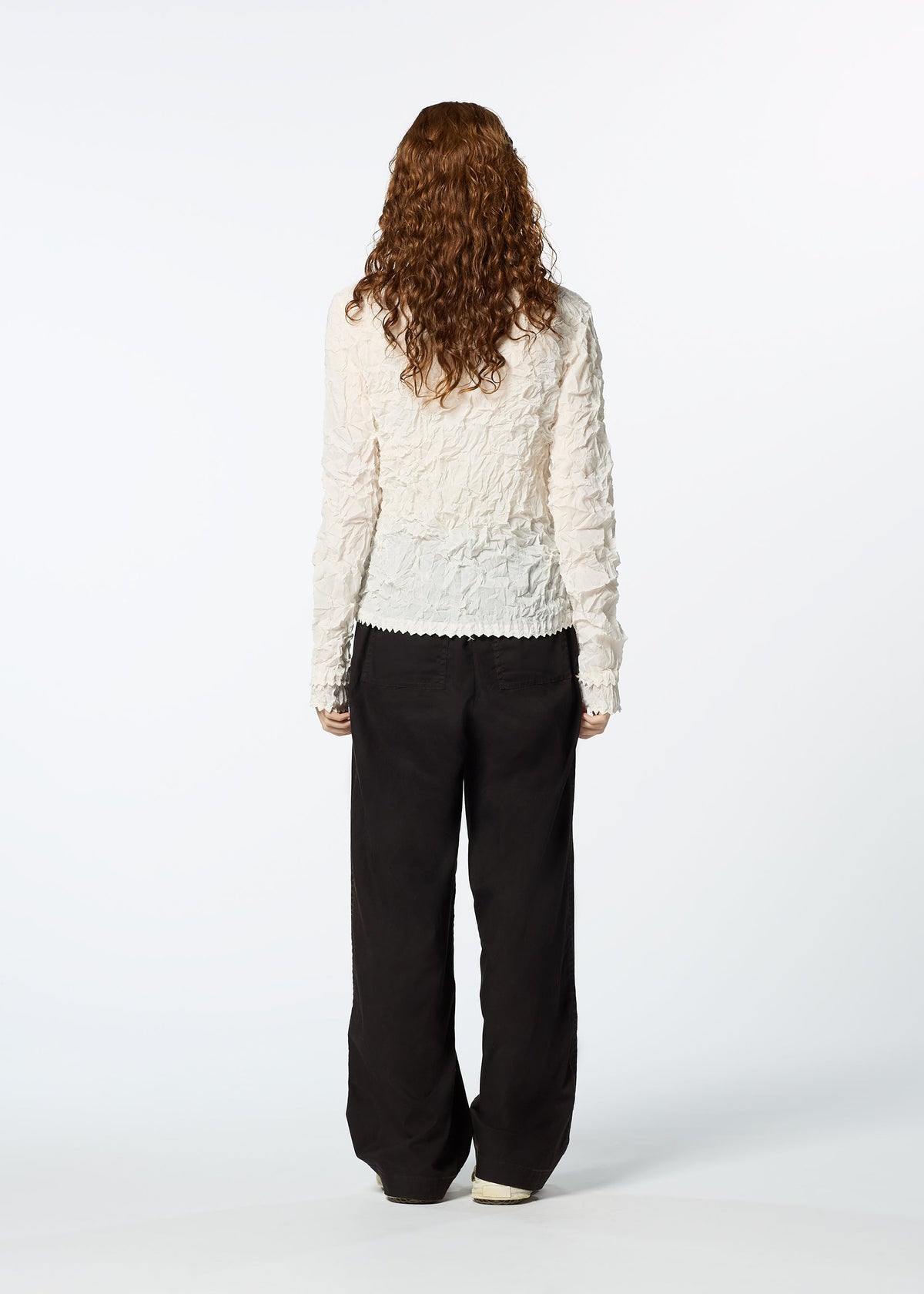 A model wears the HAAT KUMO SHIBORI SHIRT cardigan.