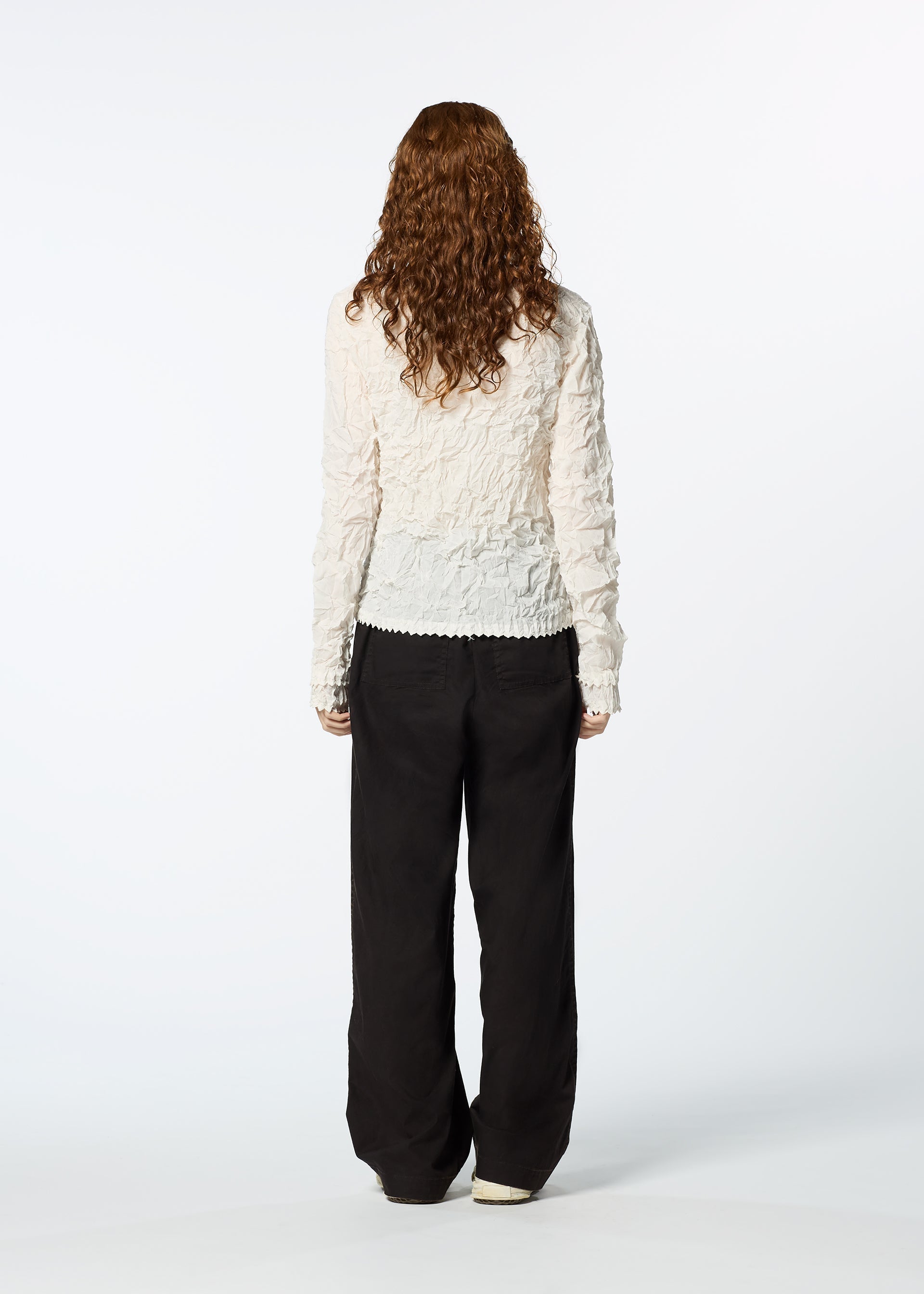 A model wears the HAAT KUMO SHIBORI SHIRT cardigan.