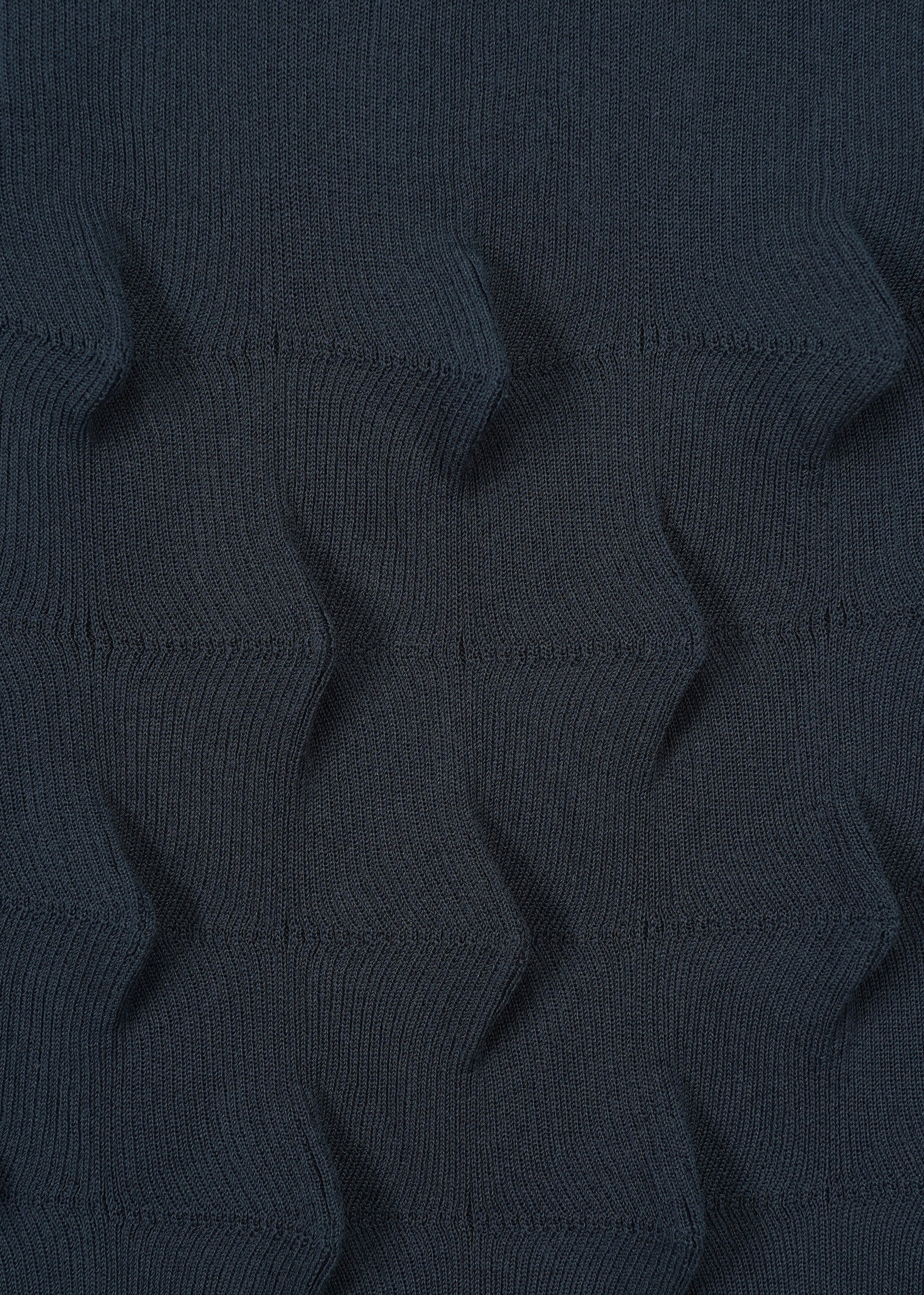 A detail shot of the HAAT ZIG ZAG KNIT skirt.