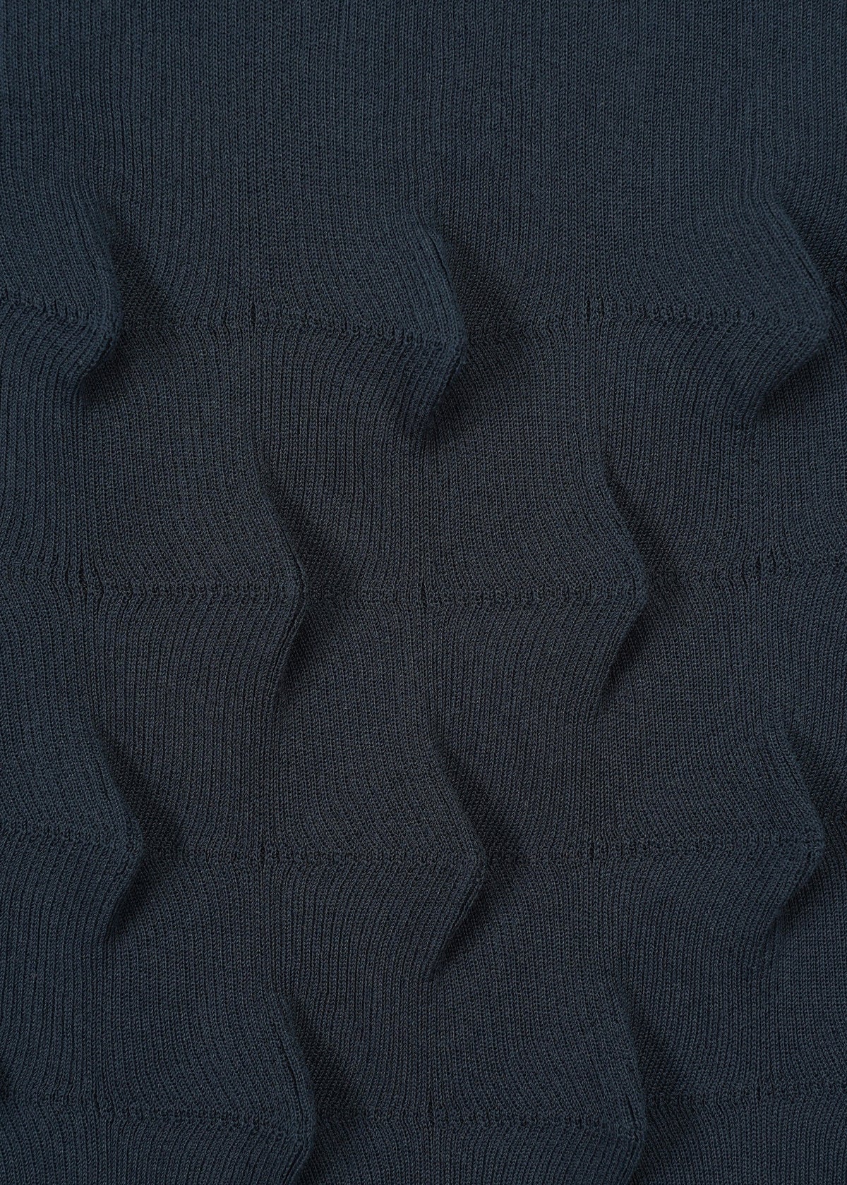 A detail shot of the HAAT ZIG ZAG KNIT skirt.
