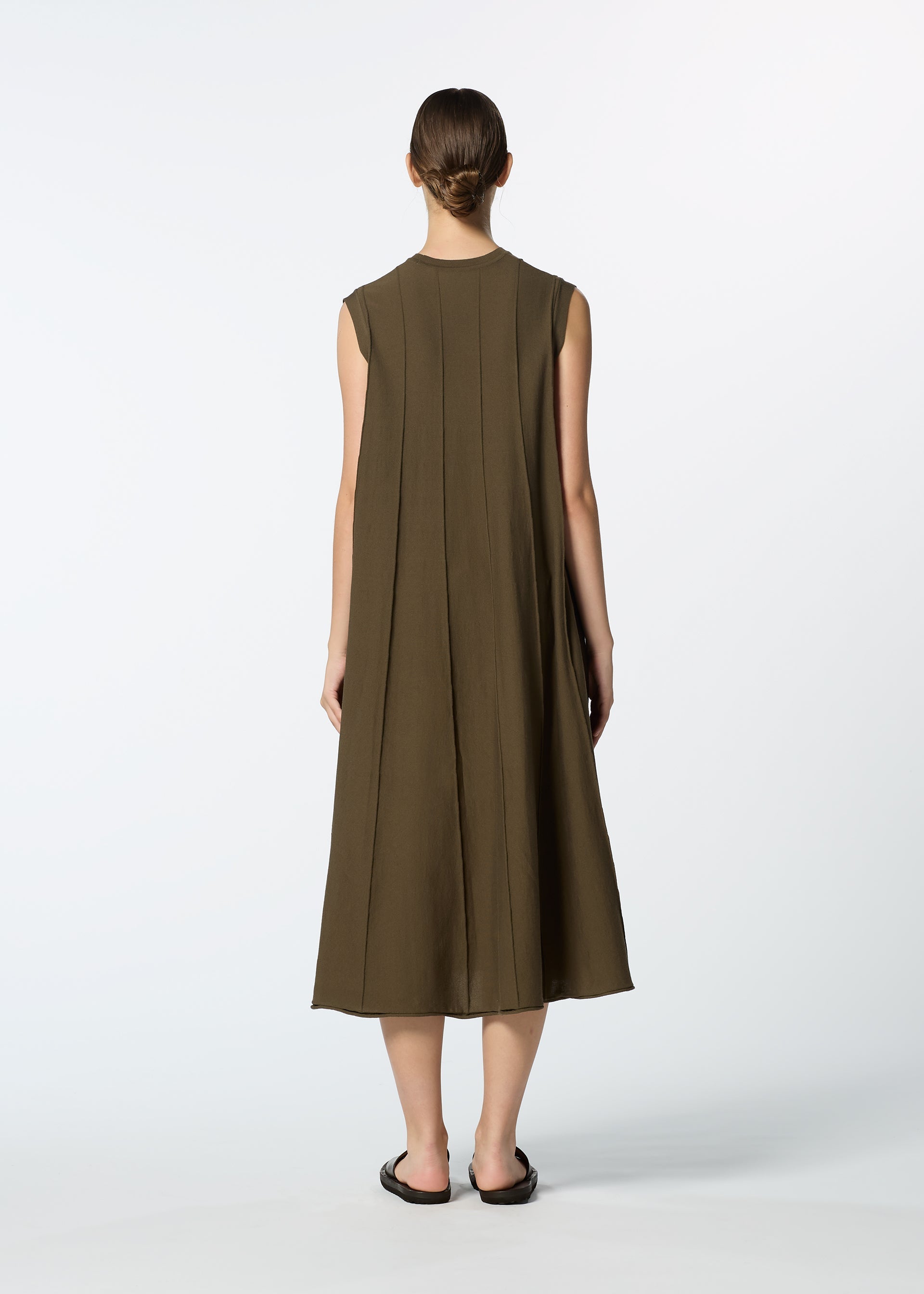 A model wears the HAAT RADIAL LINE KNIT dress.