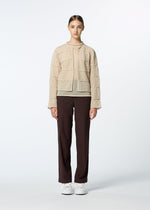 A model wears the HAAT CURLING SHEER KNIT cardigan.