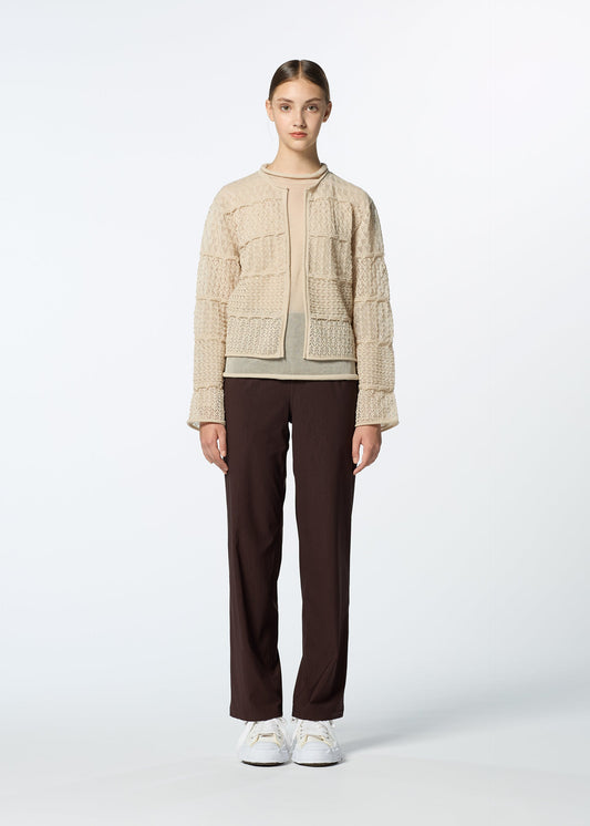 A model wears the HAAT CURLING SHEER KNIT cardigan.