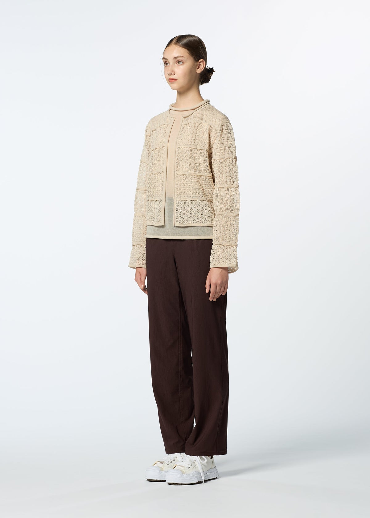 A model wears the HAAT CURLING SHEER KNIT cardigan.